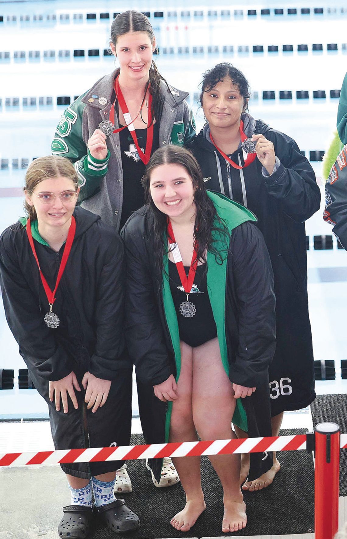 The Lady Dawg 400 free relay team of (back row) Caroline Lunsford and Graciela Lara Duran, and (front row) Madison Lawry and Sophia Cardenas placed second at district earning a regional berth. Photos by Wayne Craig/Clear Memories